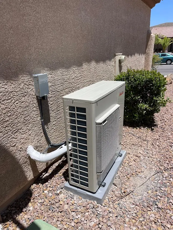 Residential air conditioning condenser unit in Rawlins